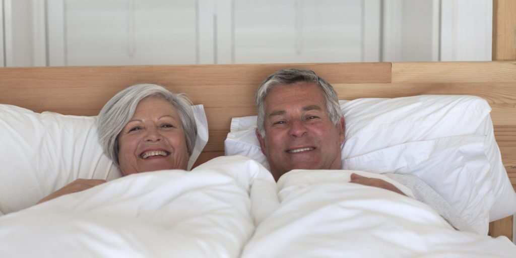 Senior couple in bed sleeping
